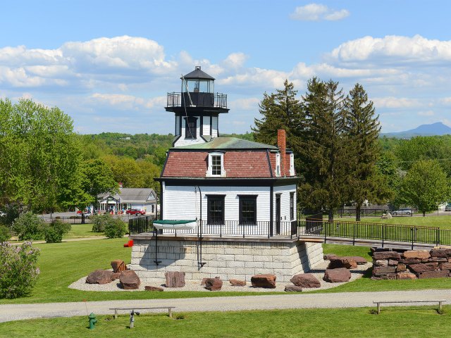 A white home with a small lighthouse on top