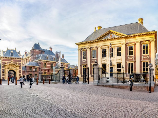 Tourist taking photo of Mauritshuis in the Hague