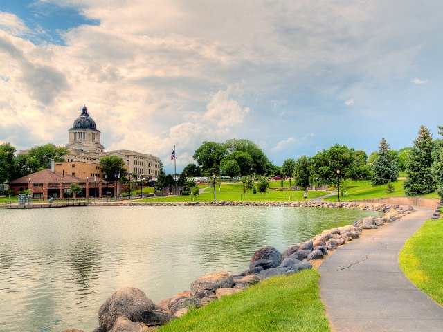 View across lake of South Dakota state capitol building