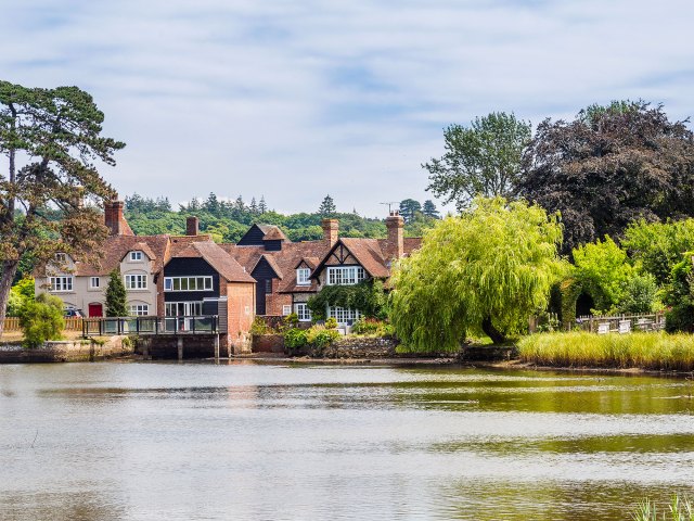 Cottages along river in Hampshire, England