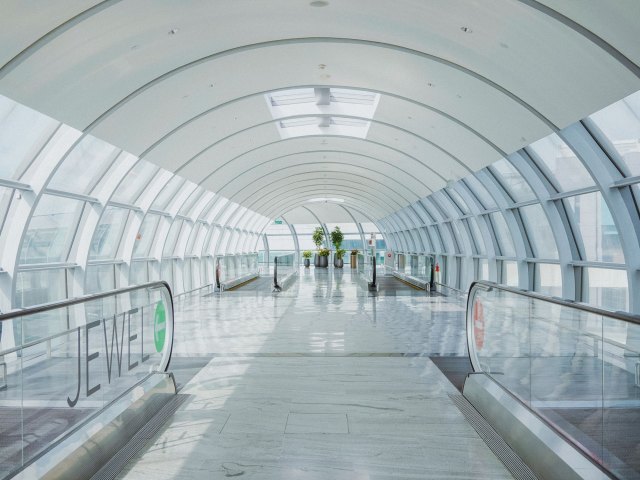 Escalators in empty tunnel at airport