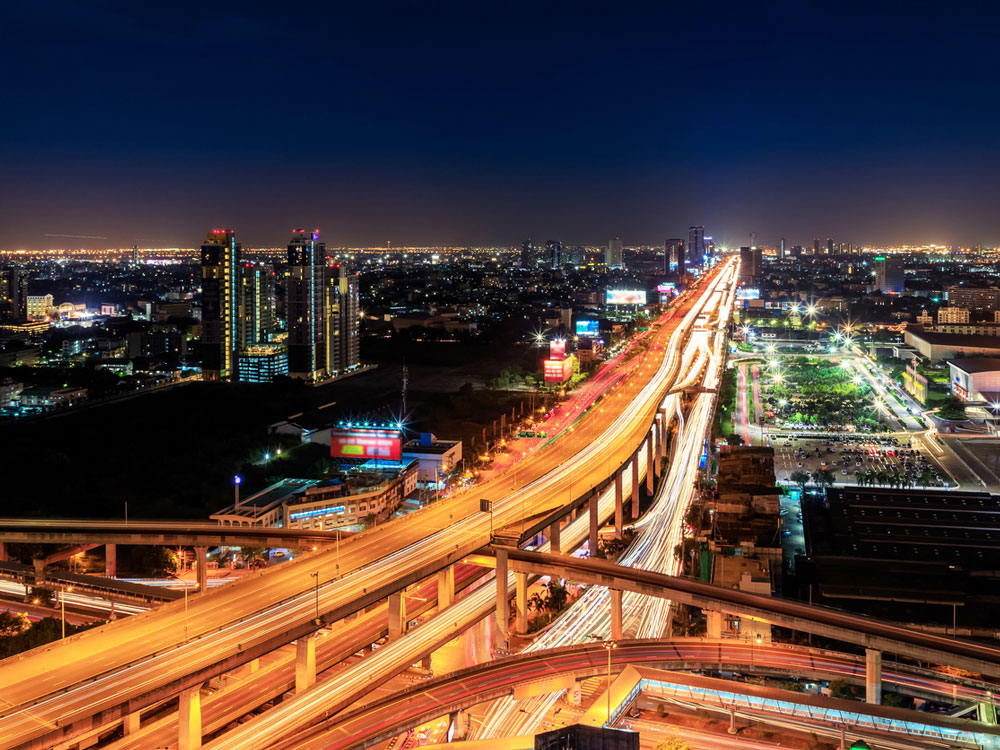 Aerial time-lapse shot of Thailand's Bang Na Expressway at night 