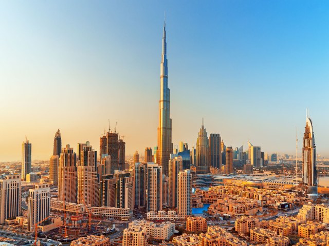 Burj Khalifa towering over Dubai, UAE skyline at sunset