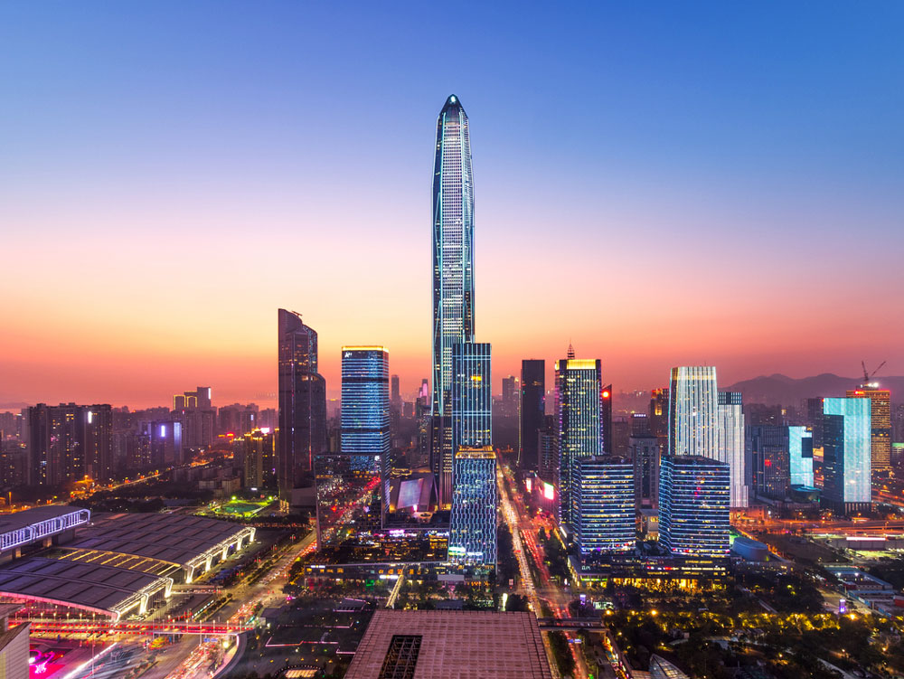 Ping An Finance Center towering over Shenzhen, China skyline at sunet