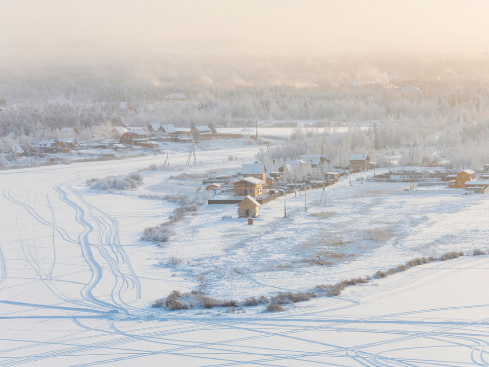 A picture of a sparse settlement covered in snow