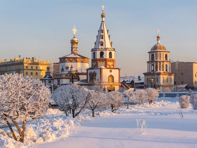 A picture of Russian buildings in a snow-covered city