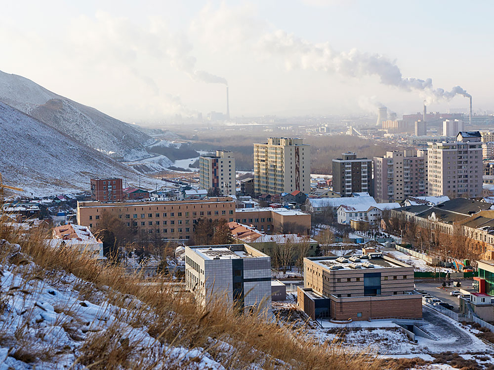 A distant photo of Ulaanbaatar covered in snow