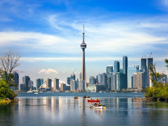 Canoes in Lake Ontario with Toronto, Ontario skyline in background