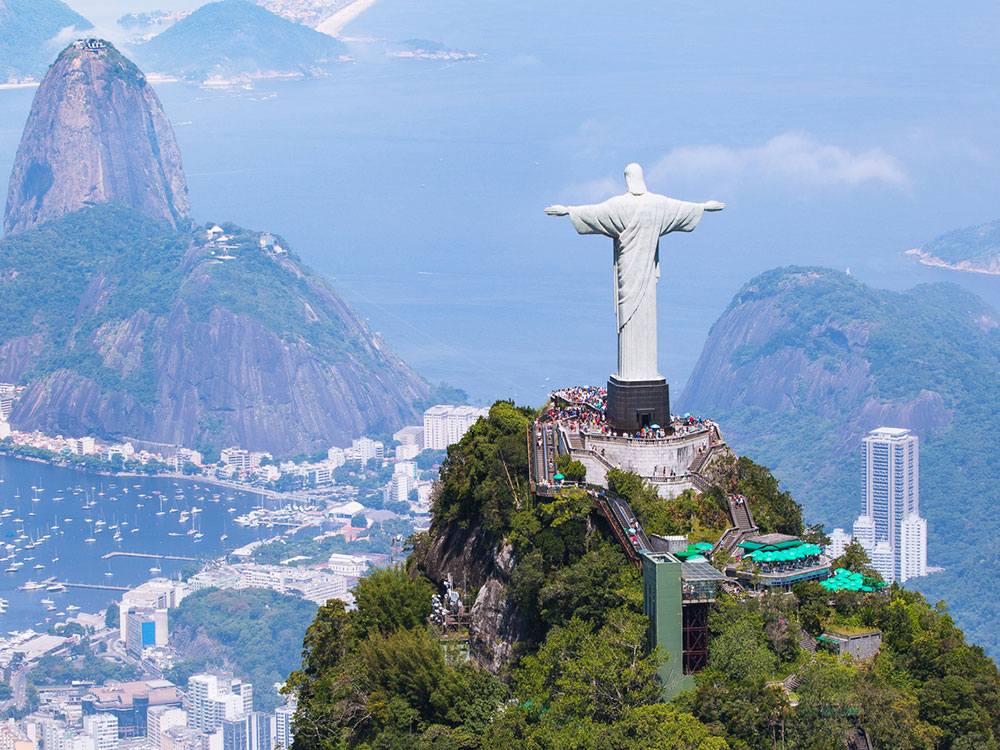 An aerial photo of the statue of Christ the Redeemer overlooking Rio de Janeiro