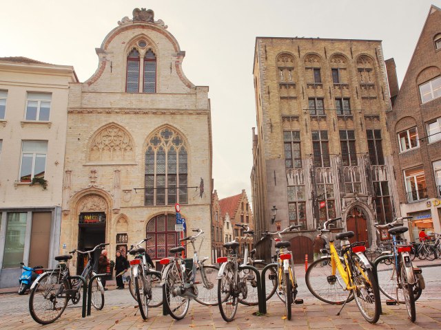 Bicycles parked in city square in Bruges, Belgium