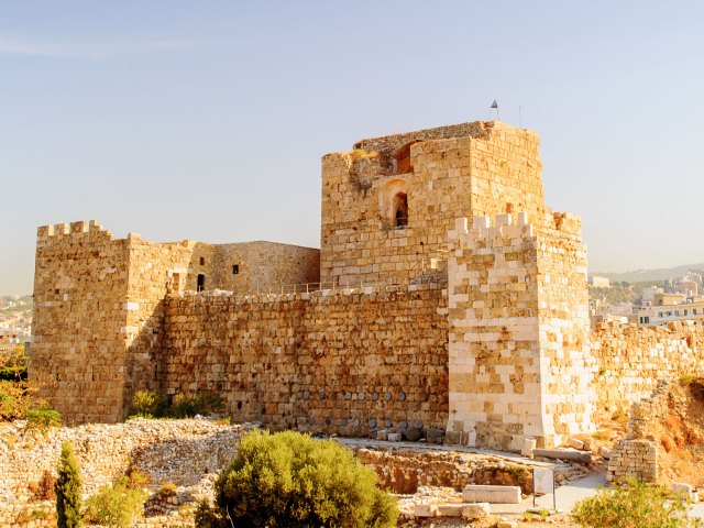 A tall ruin of a sandstone brick building in Byblos