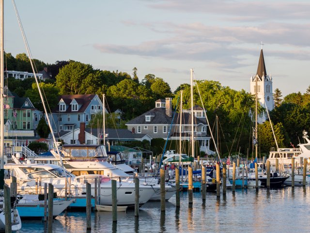 Several sailboats docked in a harbor