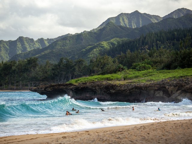 People surfing on Hawaii beach