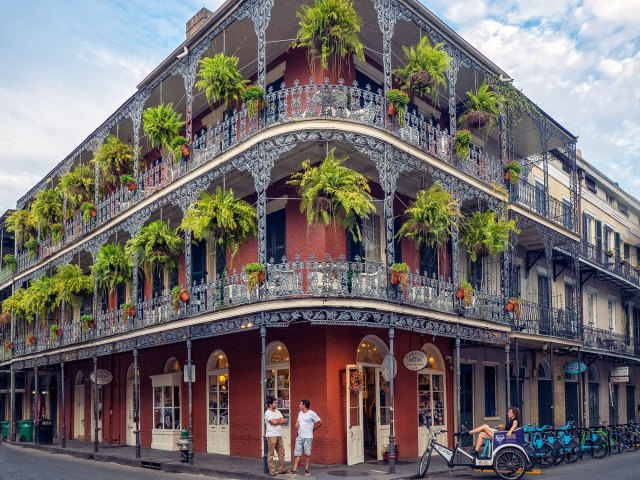 Traditional building with wrought-iron balconies on Bourbon Street in New Orleans
