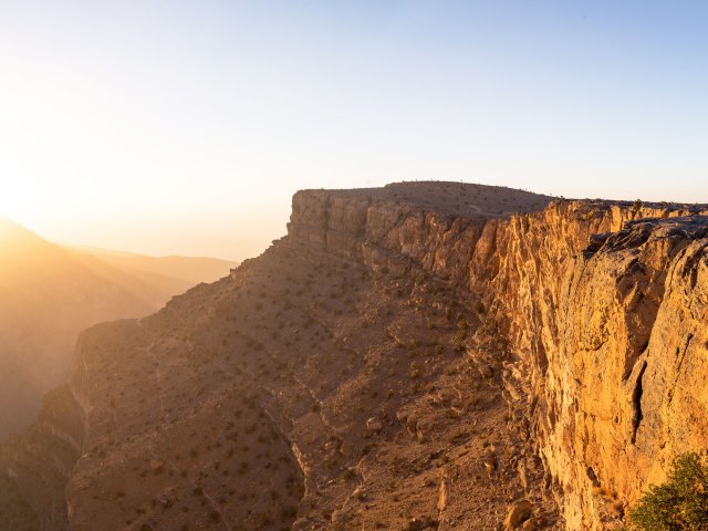Oman's Wadi Nakhar canyon seen from above at sunset
