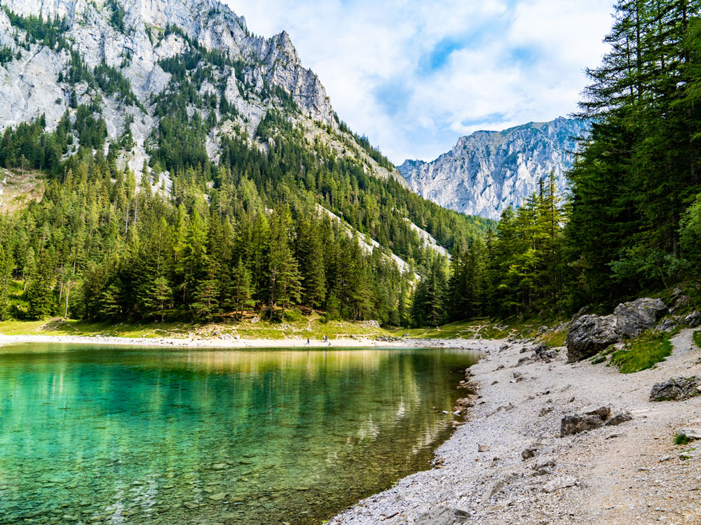 Translucent waters of Grüner See surrounded by mountains in Austria