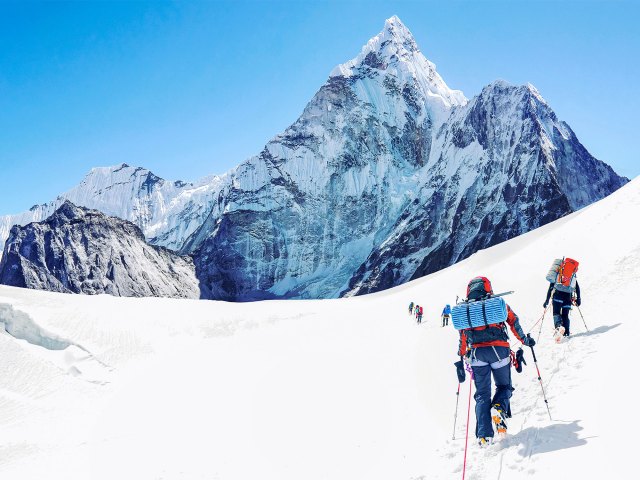 Trekkers climbing up a snowy Mount Everest