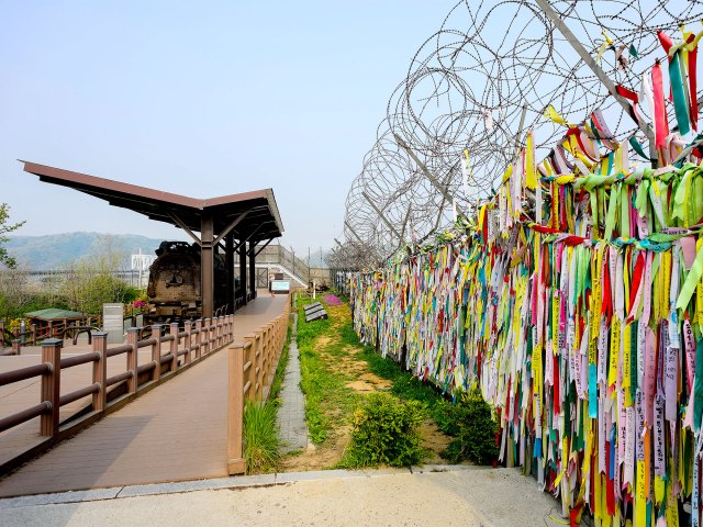 Barbed wire and colorful fencing in the Korean Demilitarized Zone (DMZ)