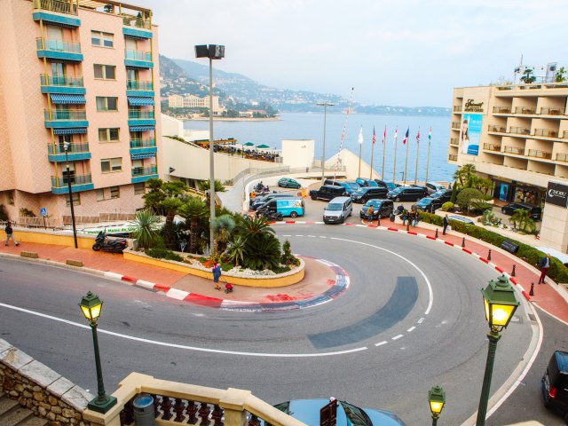 Street with hairpin curves down hill in Monaco, seen from above