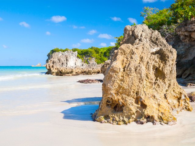 Rock formations along sandy coastline of Hispaniola