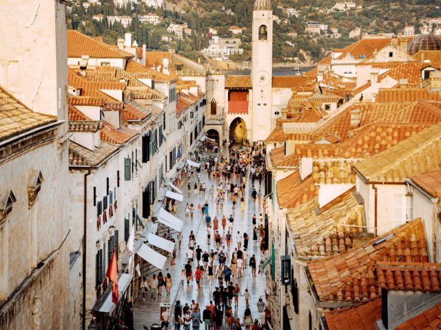 Crowds walking through streets of Old Town Dubrovnik, Croatia, seen from above