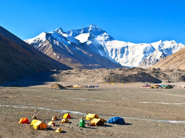 Colorful tents in valley of the Himalayas, seen from above