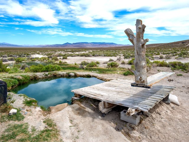 Overview of Spencer Hot Springs surrounded by Nevada desert and mountains