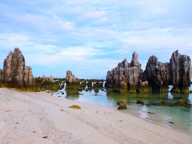 Rock formations and sandy beach in Nauru