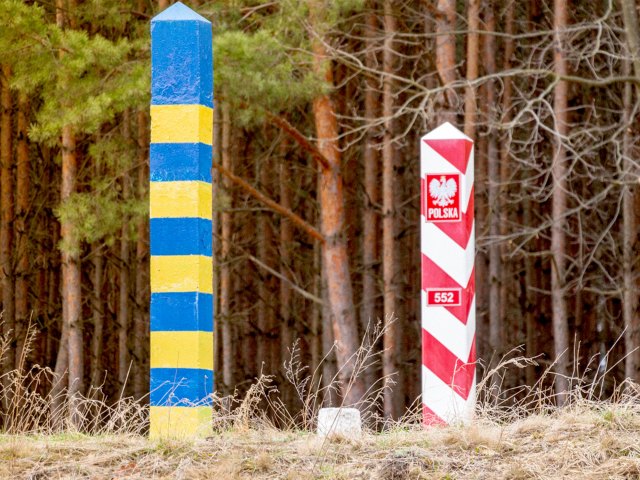 Signs in forest marking Poland-Ukraine border