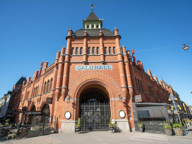 Red brick exterior of Östermalms Saluhal in Stockholm, Sweden