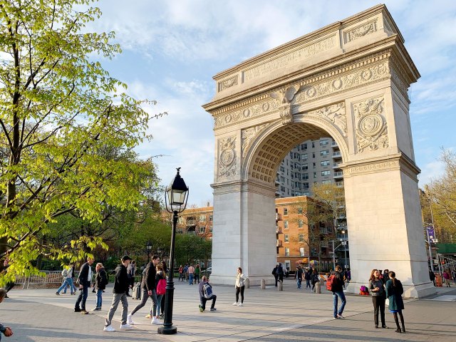 People gathered around Washington Square Arch in New York City