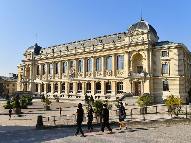 People walking in front of National Museum of Natural History in Paris, France