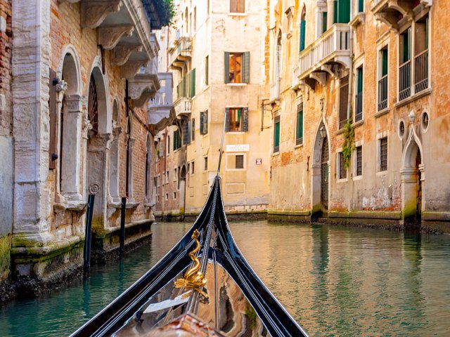 Gondola navigating Grand Canal of Venice, Italy