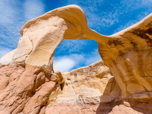 View from ground up of Metate Arch in Utah