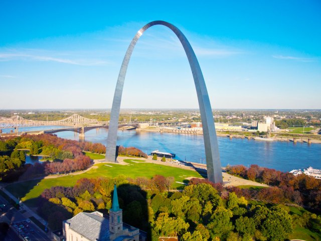 Gateway Arch towering over Missouri River and St. Louis skyline