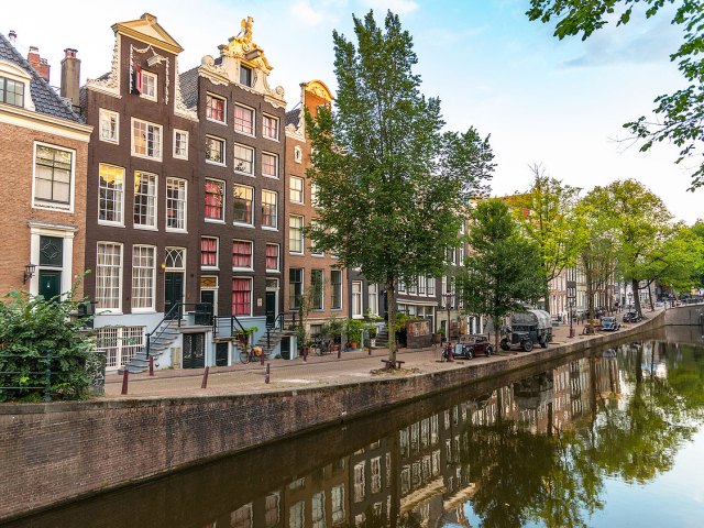 Traditional Dutch homes along canal in Amsterdam, Netherlands