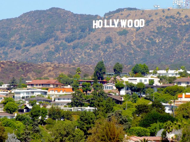 View of Hollywood Sign in the distance above homes in Los Angeles, California