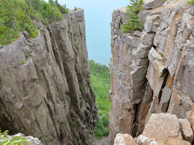 View of lake between steep rock cliffs in Ontario, Canada