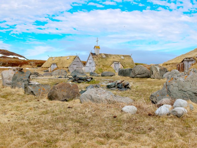 Buildings and stones at L’Anse aux Meadows National Historic Site in Canada