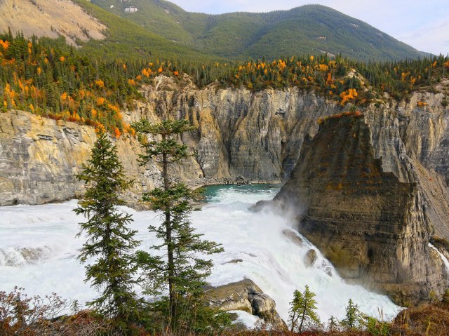 View of rushing river from mountaintop in Nahanni National Park in Canada