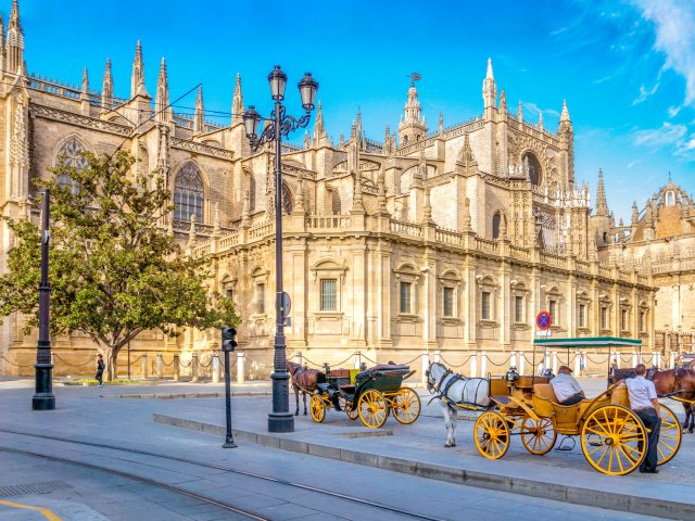 Horse-drawn carriage in front of Spain's Seville Cathedral