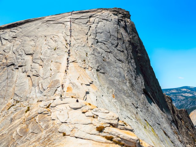 Cables leading to the top of Half Dome mountain in Yosemite, California