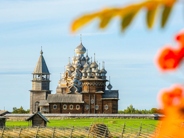 View between trees of Kizhi Pogost church in Russia