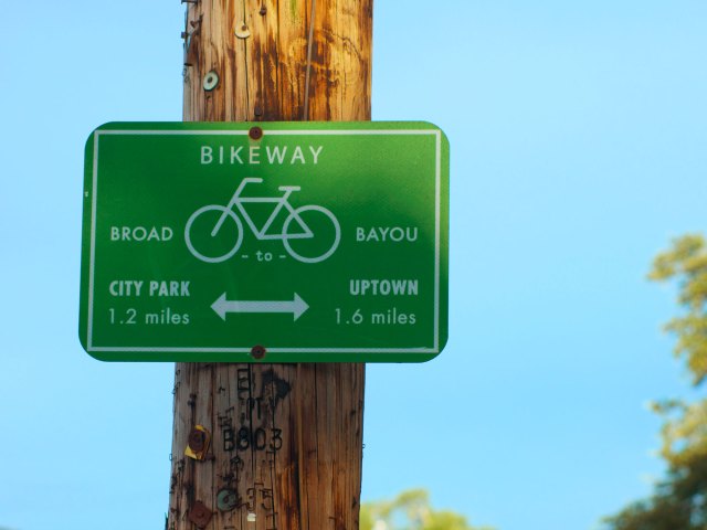 Sign indicating bike path on Lafitte Greenway in New Orleans