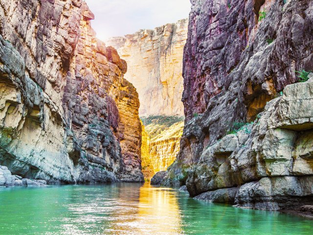 River through tall, narrow gorge in Big Bend, Texas