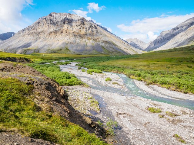 River winding through mountainous landscape of Gates of the Arctic National Park in Alaska