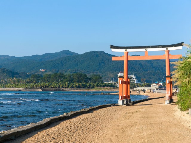 Traditional orange Japanese temple gate on Aoshima Island in Japan