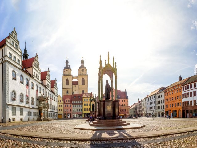 Religious statue and church in Wittenberg city square