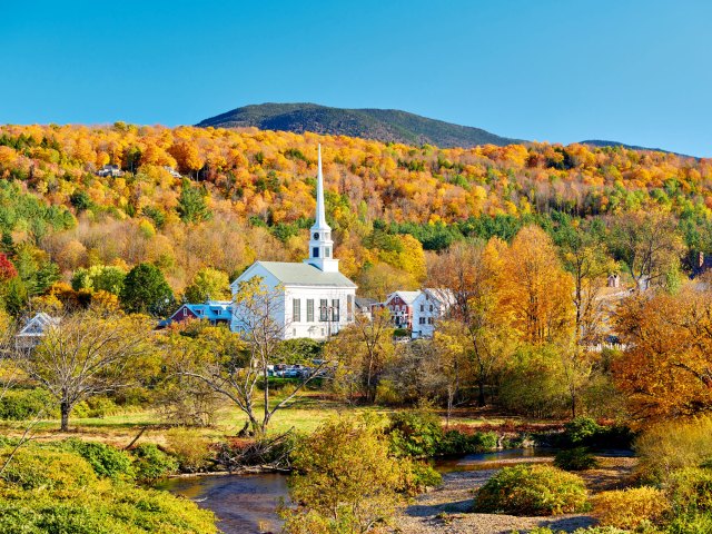 Church in Stowe, Vermont, surrounded by fall foliage