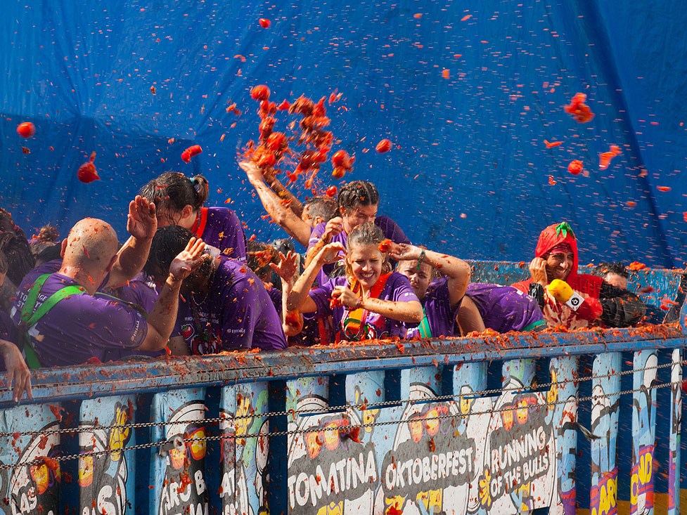 Festival goers throwing tomatoes at La Tomatina festival in Spain